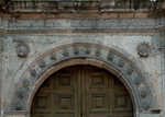 San Agustín, lateral door, archivolt & spandrel shells