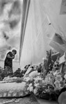 Viewing floral tributes bw