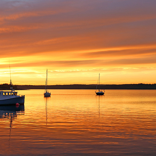 Boats docked at Renforth Wharf (@ Rothesay, New Brunswick) become silhouetted against the vivid evening sky & it's wa…