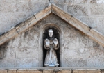 Façade, main portal, pediment sculpture, St. Francis