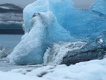 Waterfall on blue iceberg, Jokulsarlon, Iceland