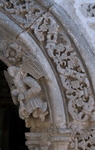 Façade portal, right pilaster Passion angel