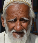 India Porbandar man by stall