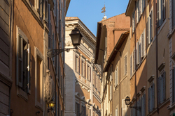 Architectural details on buildings above the streets of Rome, It
