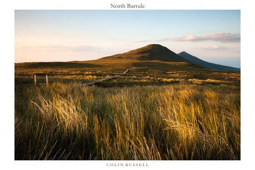 Late evening light catching North Barrule and the walkway across the marshy moorland.