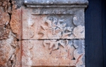 San Francisco de Asís, N portal, left pilaster relief, sun