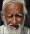 India Porbandar man by stall
