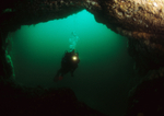 Diver explores natural arch