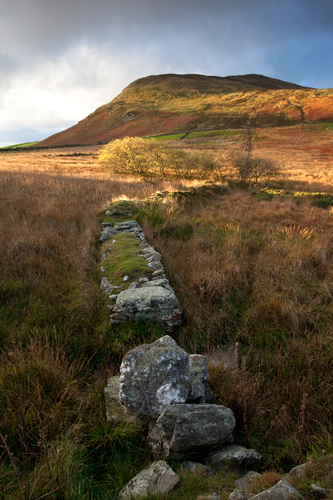 November day break light catches the slopes of North Barrule.
