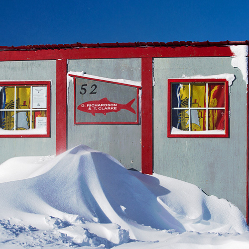 An ice fishing hut with Provincial Flag Curtains within the Renforth Ice Fishing Village in Rothesay, NB, Canada.