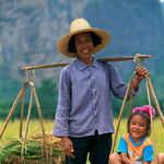 Woman with basket and child, Guilen, China
