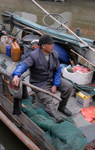 China Shanghai Zhu Jia Jiao water town fisherman on boat