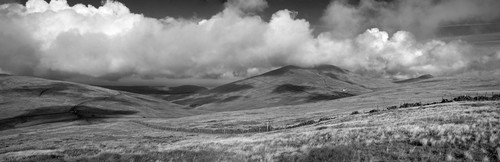 Several shots stitched to create a panoramic view towards Snaefell and North Barrule under wonderful cumulus clouds a…