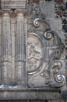 Façade, second story columns & Franciscan insignia (right)