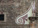 San Andrés, façade, main portal, left volute