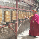 A smiling Buddhist monk  praying at  a temple, Lhasa,Tibet