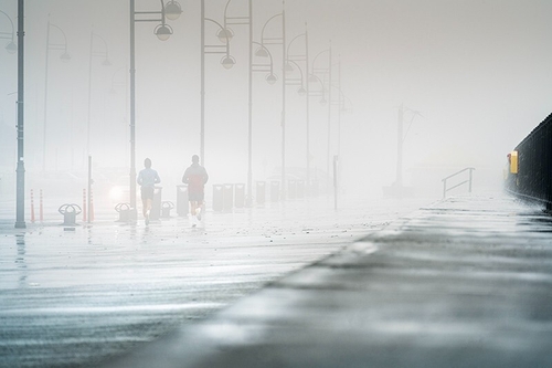 Running in hight tide and fog Tramore
