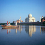 Boatman and  children with Taj Mahal