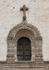 Façade, choir loft window & cross