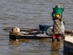 Senegal Lac Rose salt production 10 woman carrying salt from boat to s