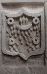 Convento portal, left pilaster voussoir, Franciscan wounds