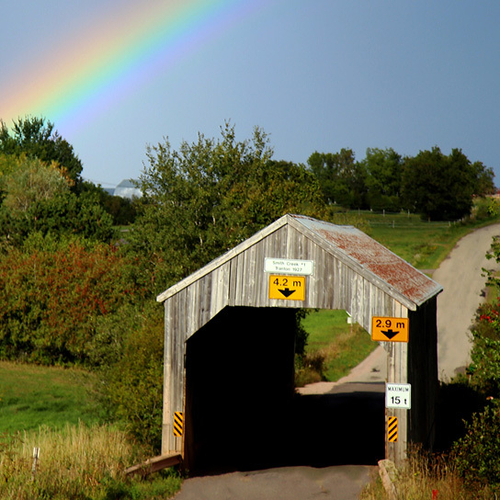 Smith Creek #1 Covered Bridge under the backdrop of a late summer's rainbow.