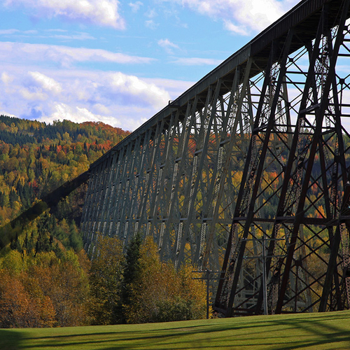 Little Salmon River Viaduct, New Denmark, NB contrasted with the hues of autumn.