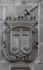 Façade escutcheon (left)