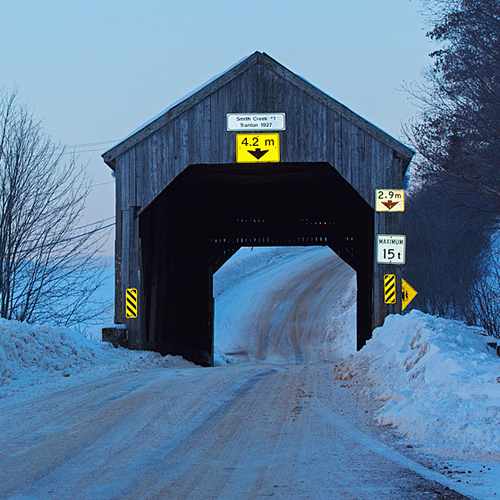 The Smith Creek #1 Covered Bridge or Tranton Covered Bridge lies along the Roachville Road near Sussex, New Brunswick…