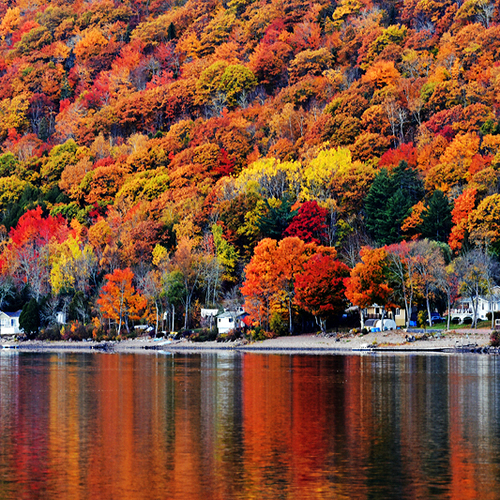 Belleisle Bay in Kings County, New Brunswick reflecting vivid autumn hues.