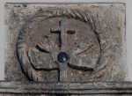 San Felipe, façade entablature, Franciscan insignia with obsidian disk
