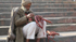 Delhi Jama Masjid man sitting on steps