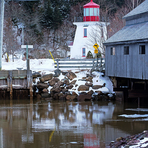The lighthouse and covered bridge at St. Martins, New Brunswick, Canada.