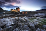 Eilean Donan Castle at dusk rocks