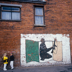 Two Children chatting next to a Belfast Mural, Ireland 1994