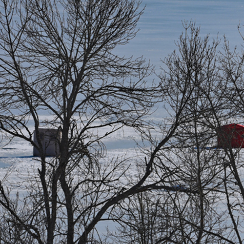 A pair of ice huts along Belleisle Bay near Hatfield Point in Kings county, New Brunswick.