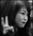 China Shanghai Zhujiajiao Water Town girl in red coat with peace 2 bw