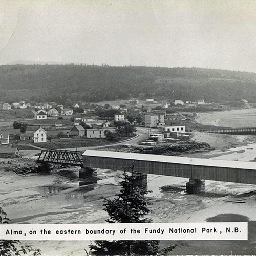 A vintage panoramic view of Alma, New Brunswick including the old covered bridge that was dismantled in the early 1970s.