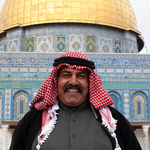 Smiling Arab man in front of The Dome of the Rock,Jerusalem, Israel