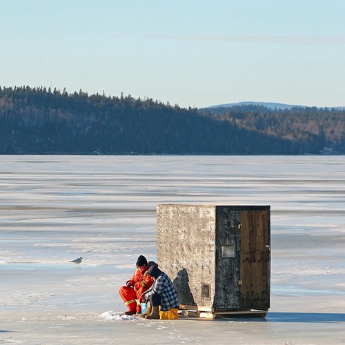 Ice fishermen try their luck along the Kennebecasis River in Rothesay, New Brunswick, Canada.