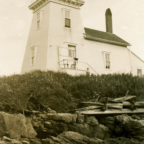 An early photo postcard of Drew's Head Lighthouse(Lighthouse Point) in Beaver Harbor, New Brunswick. A young boy can…