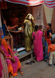 Deogarh, Rajasthan - bride being fitted for her wedding sari