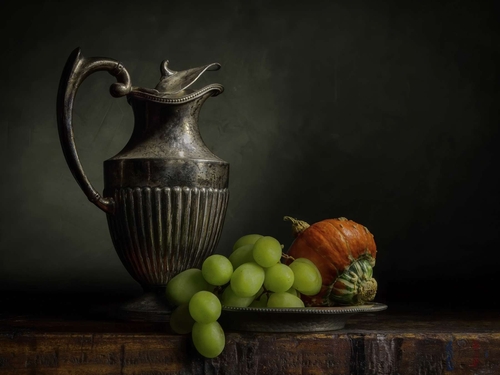 Vintage Jug. Light-painted still-life, featuring a fluted vintage jug, grapes and a gourd. Lit with diffused torchlight.