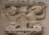 Santiago, façade portal, left inner pilaster relief, cherubs