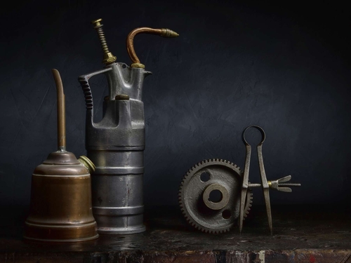 Cans, Cog and Callipers. Light-painted still-life, featuring vintage oil cans, a gear wheel and a pair of callipers.…