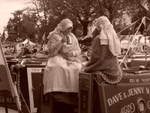 Two girls on canal boat (sepia)