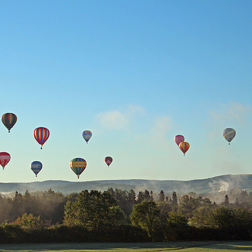 13 hot-air balloons float peacefully along the Kennebecasis River at the Atlantic Balloon Festival on Friday Morning,…