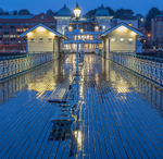 Penarth Pier in rain at night.