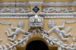 Façade portal reliefs, putti & Papal tiara