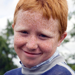 35, Young boy smiling,  Spancil Hill Horse fair, Co.Clare